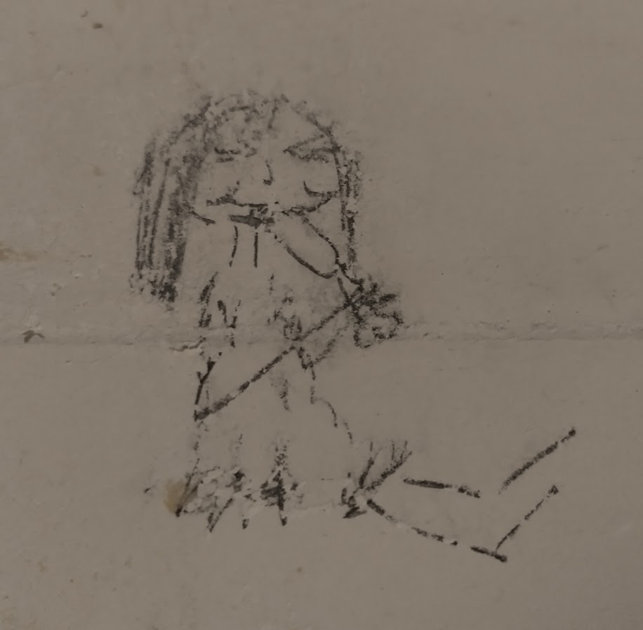 afbeelding van een potloodtekening op een muur. het is een tekening van een primitief meisje dat op een stuk vlees kauwt. ze heeft een jurkje aan van vacht en knijpt haar ogen dicht. 